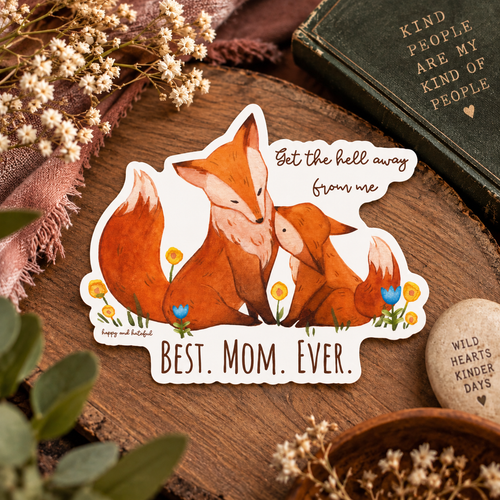A die-cut sticker featuring an illustration of a mom fox and a cub with the text 'Get the hell away from me' and 'BEST. MOM.EVER'