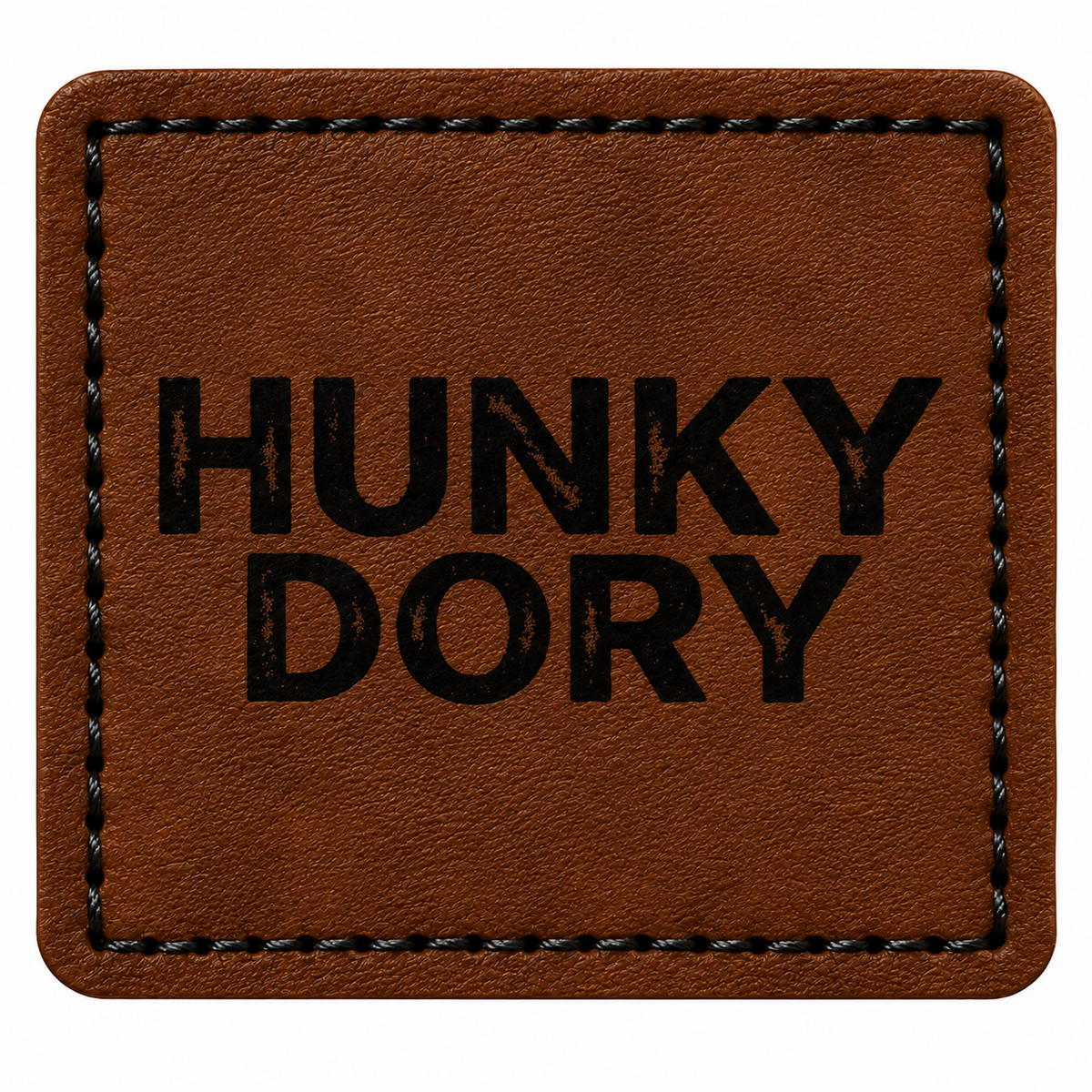 A square brown patch with rounded corners, featuring the words 'HUNKY DORY' printed in bold black capital letters in the center. The patch has a stitched border and is shown against a plain white background.