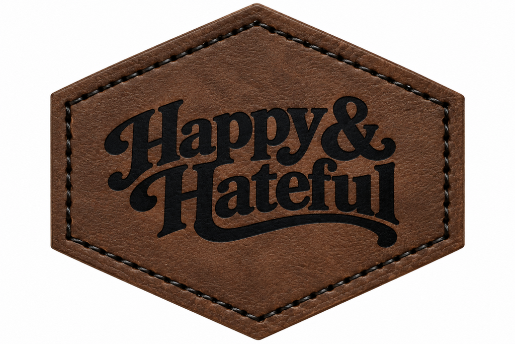 A hexagonal brown patch with black stitched borders and the words 'Happy & Hateful' in black script across the front, shown on a plain white background.