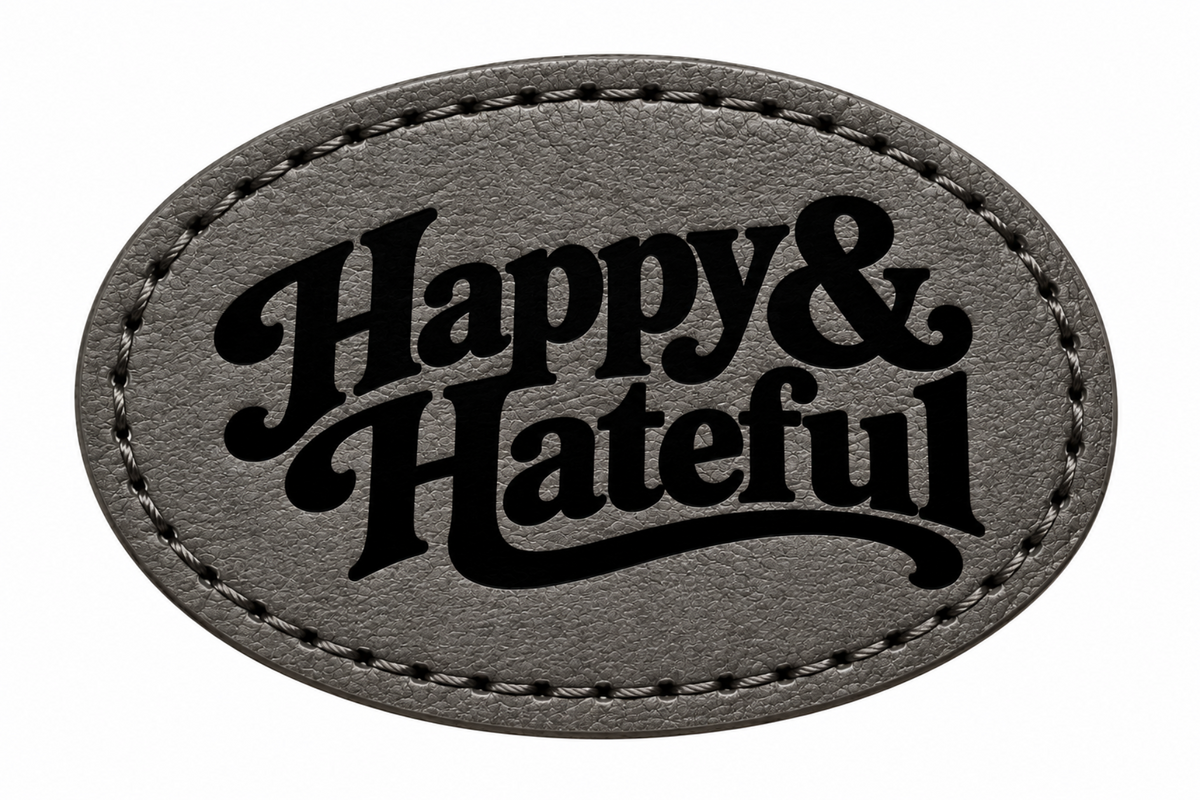 An oval-shaped black patch with black stitched borders and the words 'Happy & Hateful' in black script, shown on a plain white background.