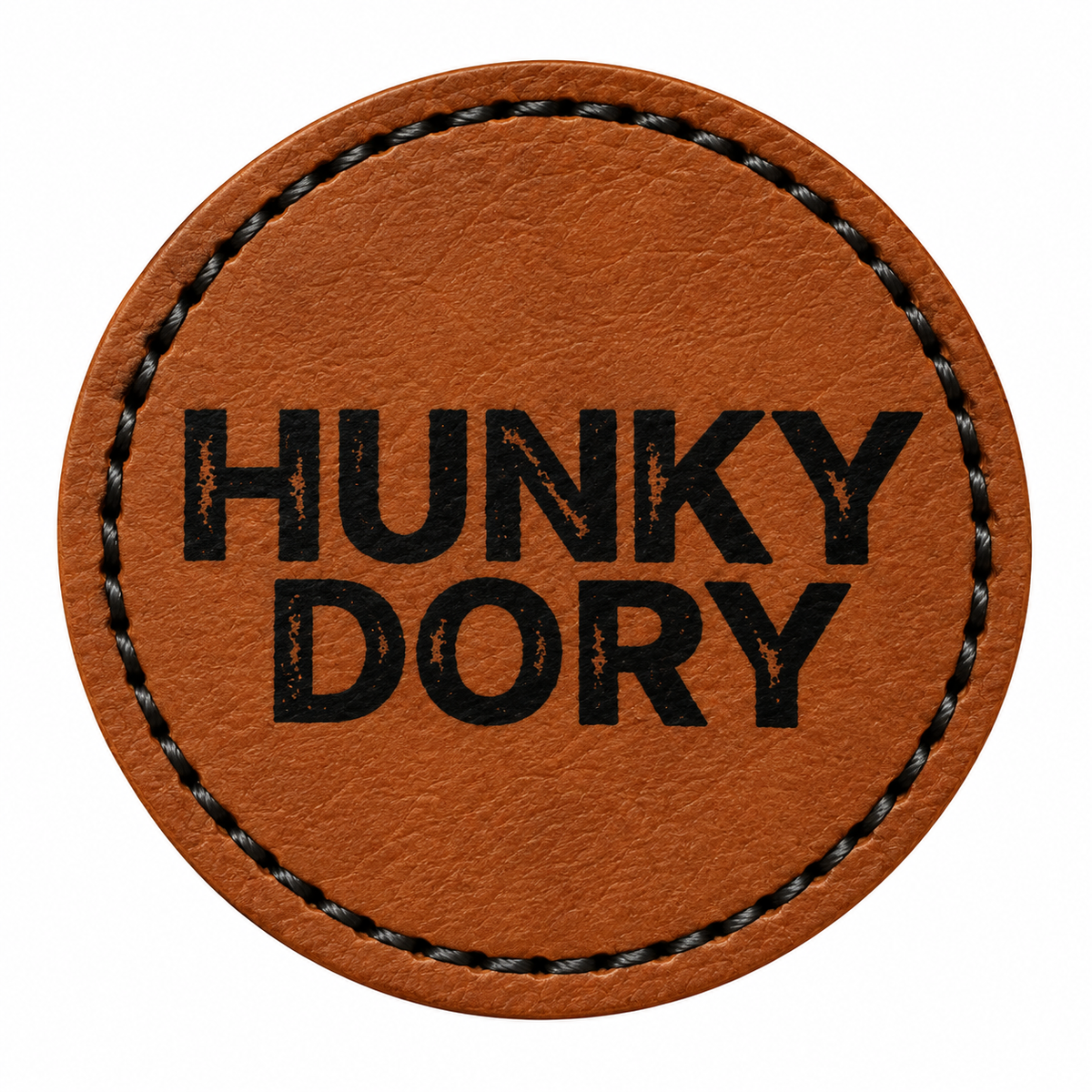 A round brown patch with black stitched border and the text 'HUNKY DORY' printed in black capital letters, shown on a plain white background.